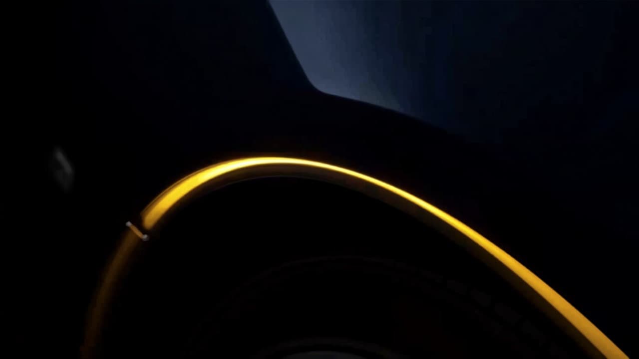 An amber highlight along the edge of a dark wheel arch